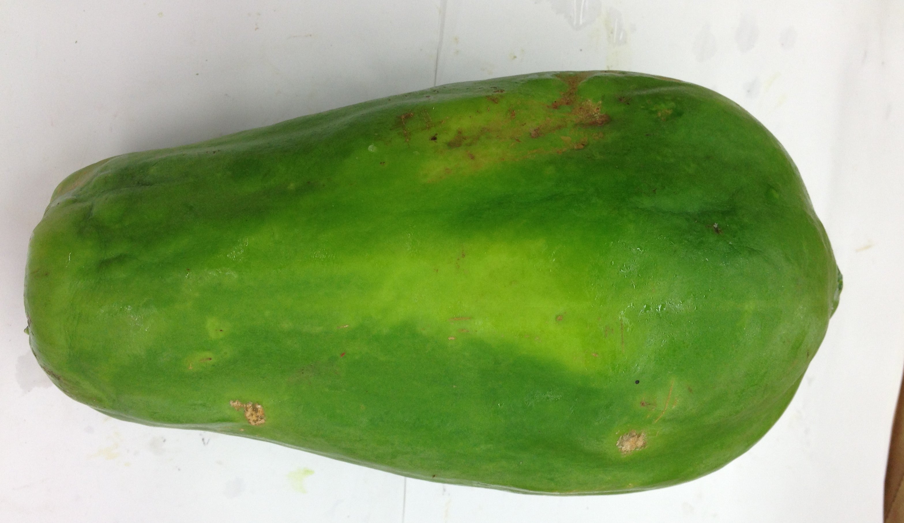 Fresh PAPAYA (Green) $-Lb